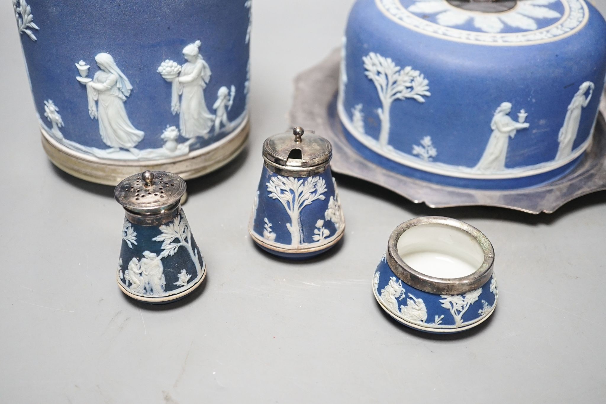 A Victorian Wedgwood blue jasper biscuit barrel and a blue jasper cheese dish cover, with a plated stand , 3 piece condiment set